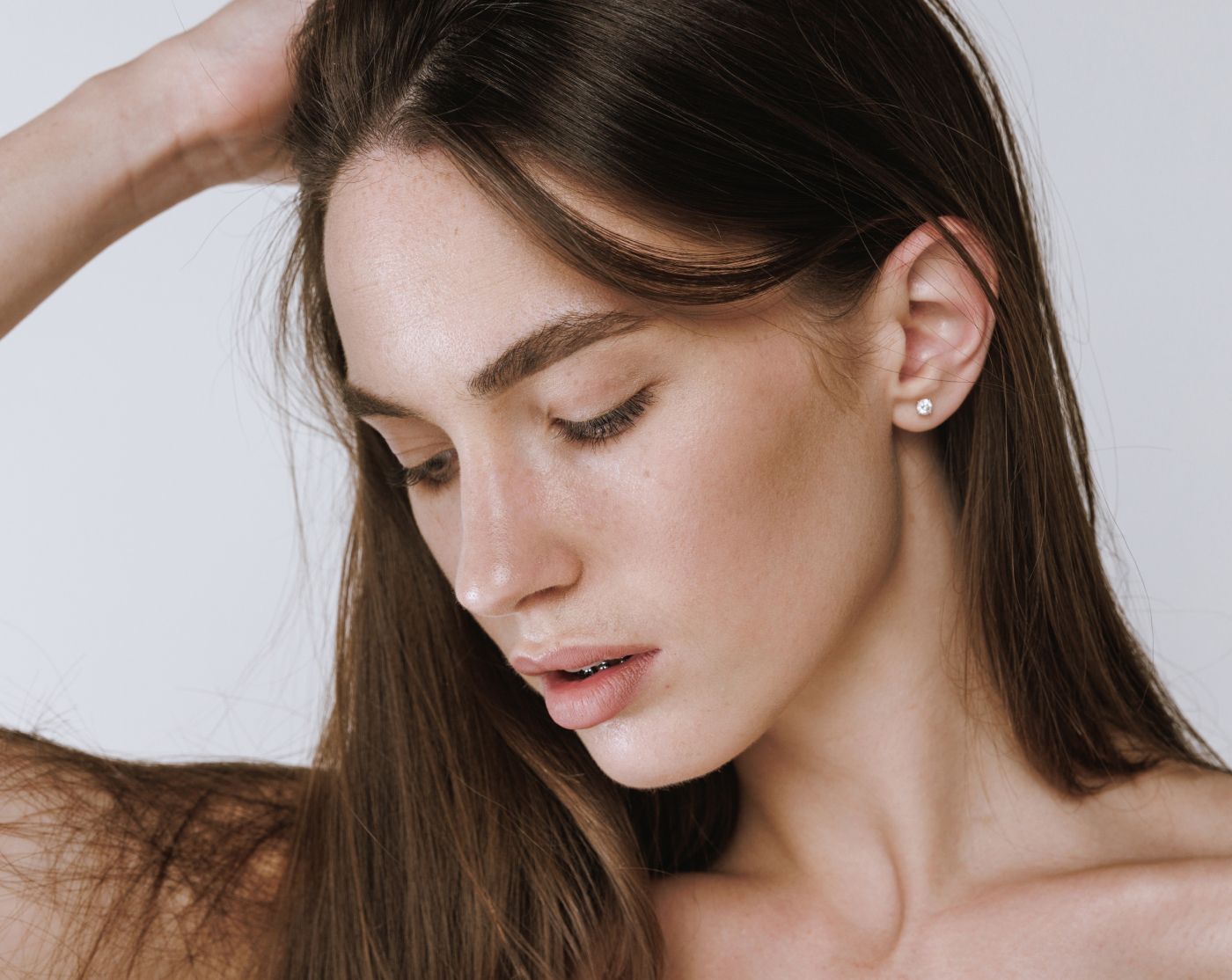 Profile of a woman with long, brown hair.